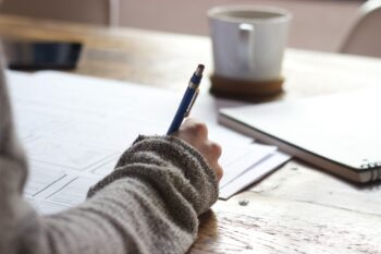Person writing in an exam